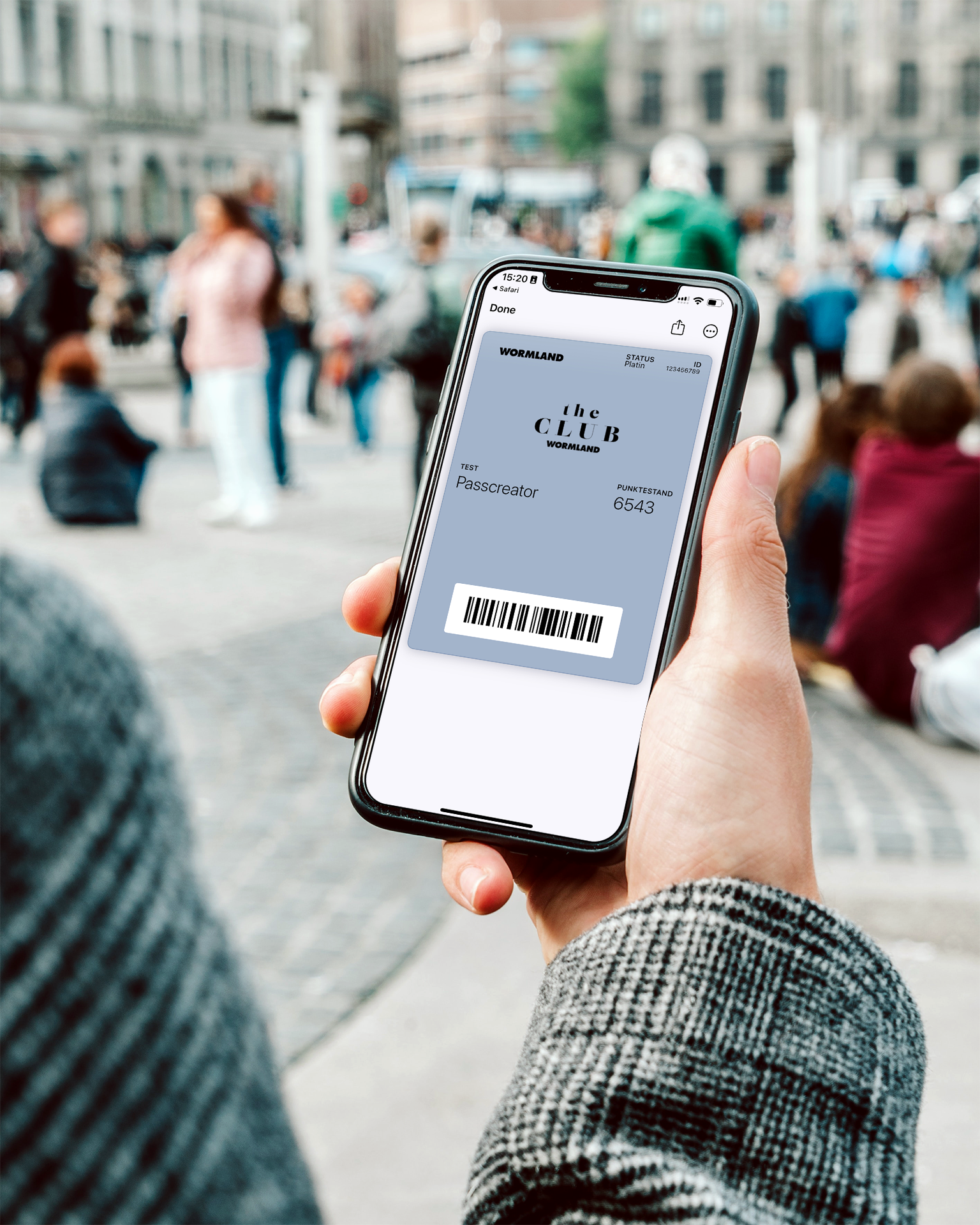 Person holding a Smartphone showing a Wallet Pass Wormland The Club Loyalty Card